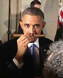 Obama sampling Cuban cigar